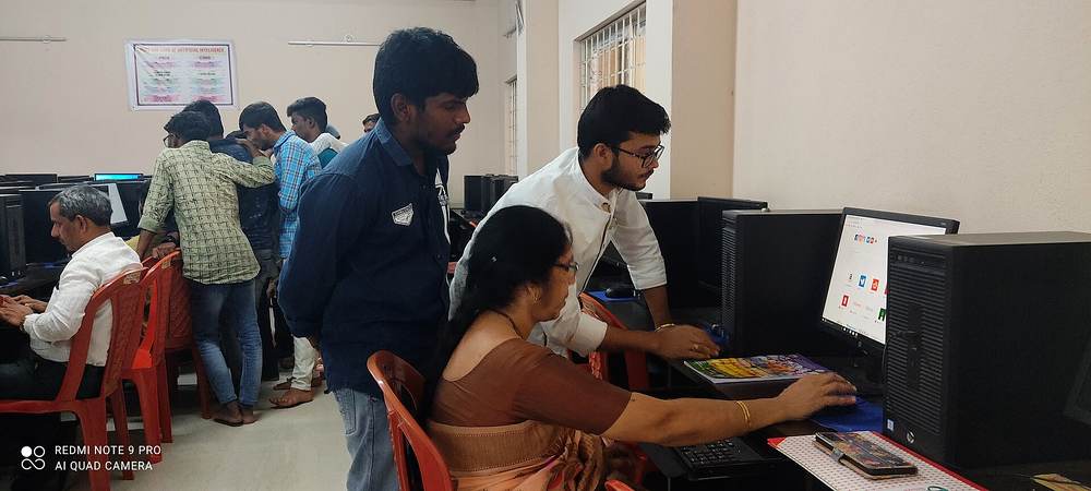 Teacher guiding a student during a practical session